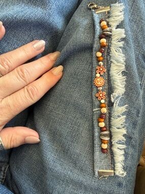 Handcrafted Multicolor Beaded Bracelet with Orange Flower Accents